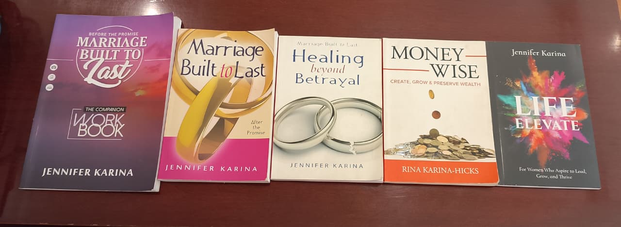 The five Anchor books on a wooden table
